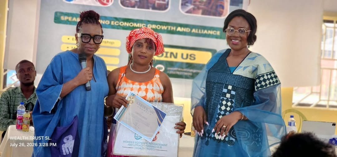 Three women celebrating a certificate presentation